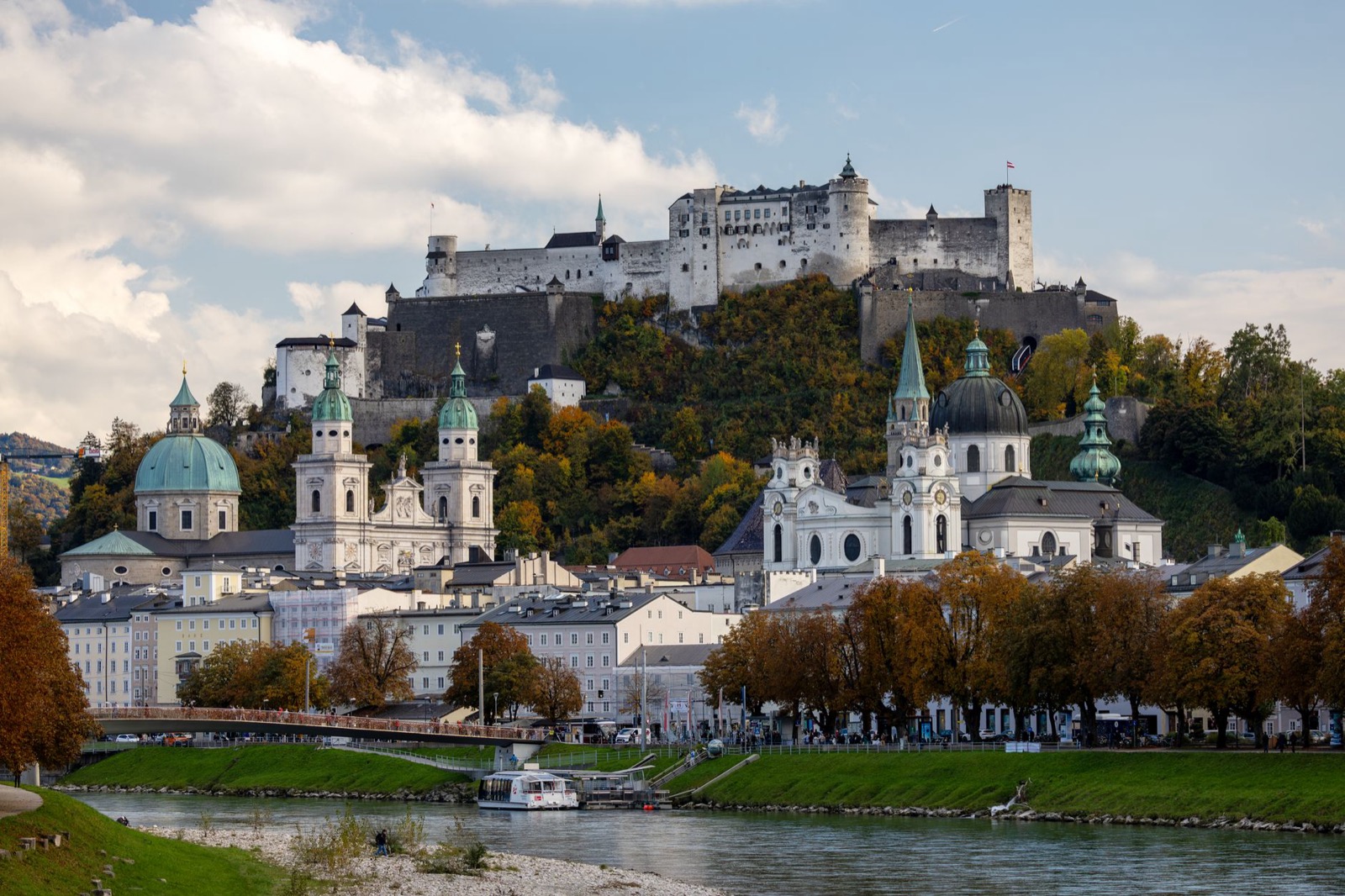 Salzburg old town below the Hohensalzburg fortress with the river in front