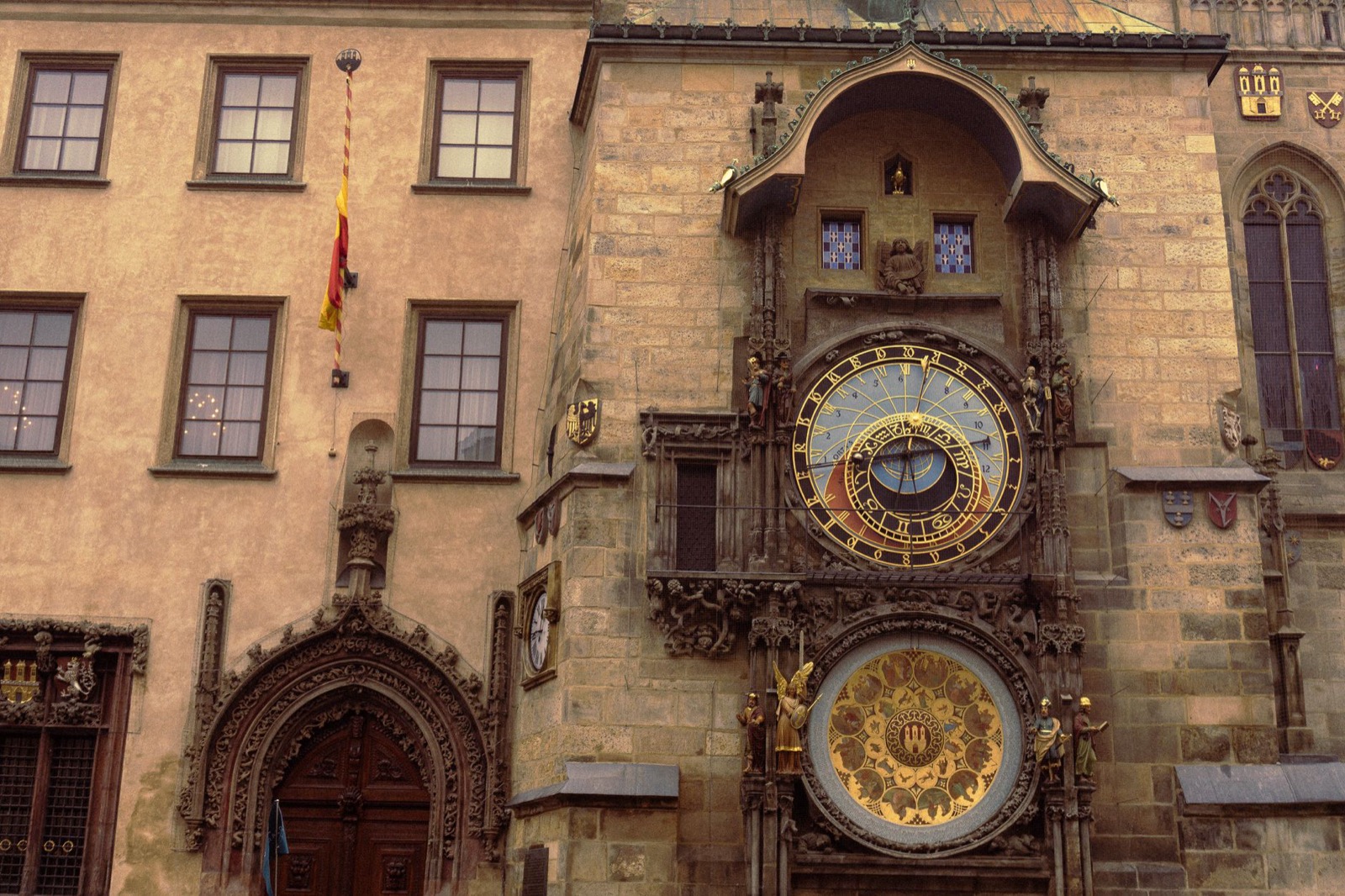 The astronomical clock and gothic facades on Prague's Old Town Square