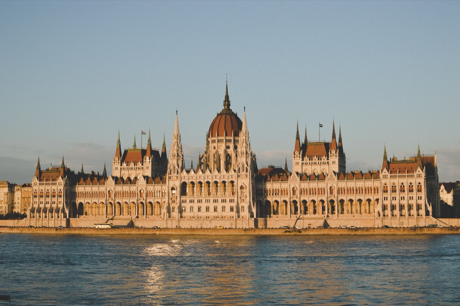 The Hungarian Parliament building along the Danube in Budapest in low golden sunlight