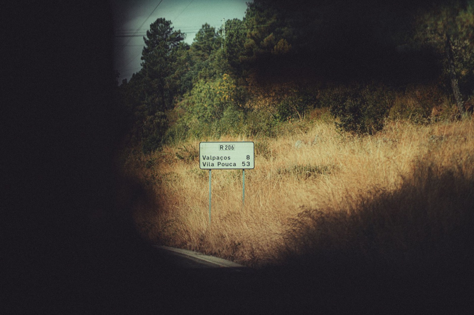A route sign beside a rural Portuguese road