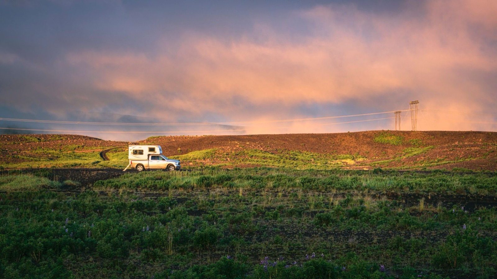 A camper parked within its own footprint on open Portuguese land